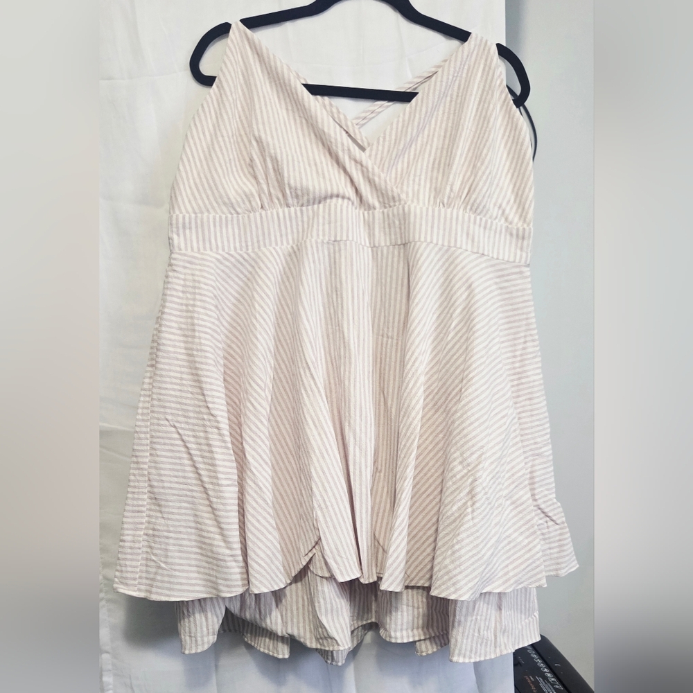 OHS brand, casual sleeveless dress with a light-colored.